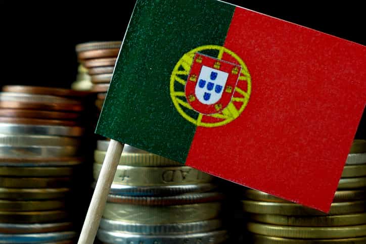Portugal Flag Waving With Stack Of Money Coins