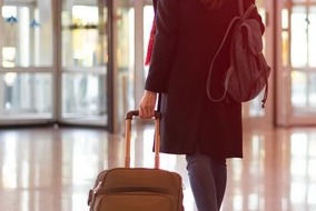 person pulling a suitcase