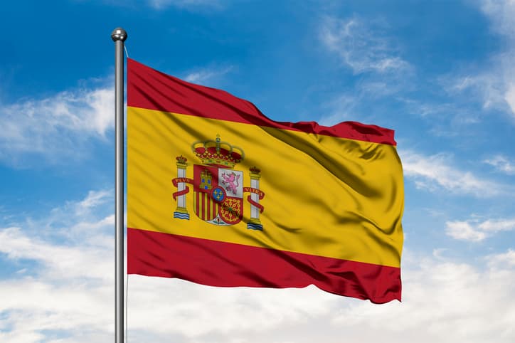 spanish flag with sky in the background