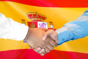 handshake with spanish flag