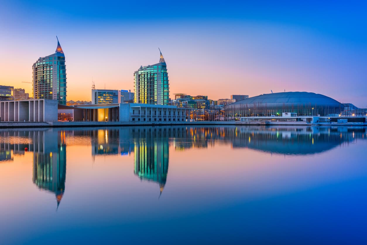 Lisbon Portugal Sunset At The Nations Park In Lisbon Modern Buildings And Altice Arena Mirrored In The Water 