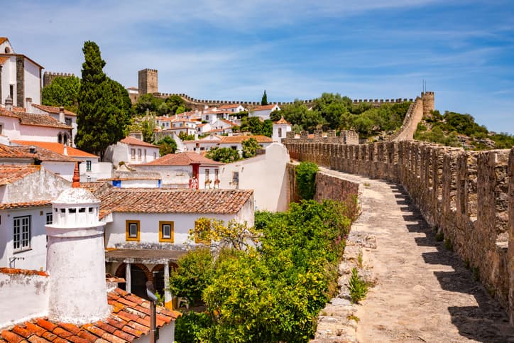 The Castle And Towers Of The Historic Old Town Of Obidos With The City Walls You Can Walk Through