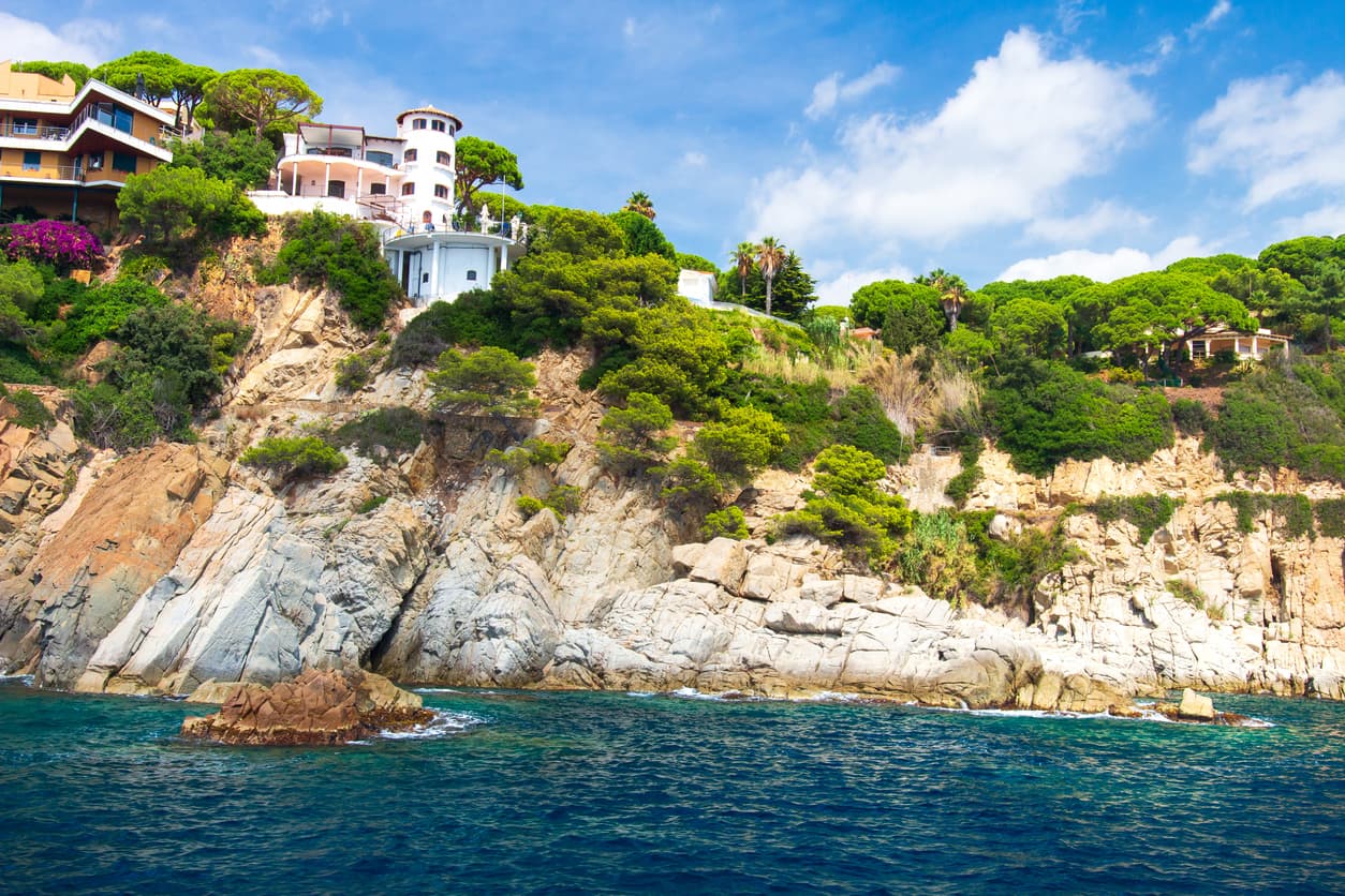 Spanish villa on rocky coast of mediterranean sea in Lloret de Mar