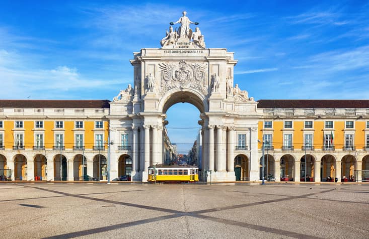 Praca Do Comercio With Yellow Tram Lisbon Portuga